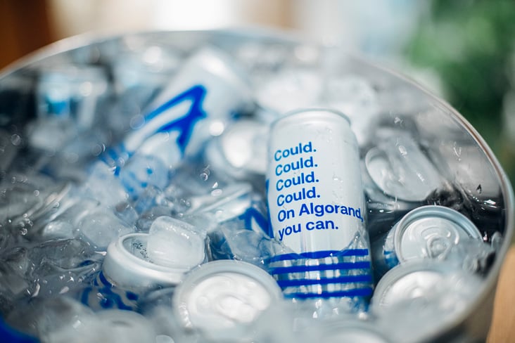 Algorand branded beverages in an ice bucket.